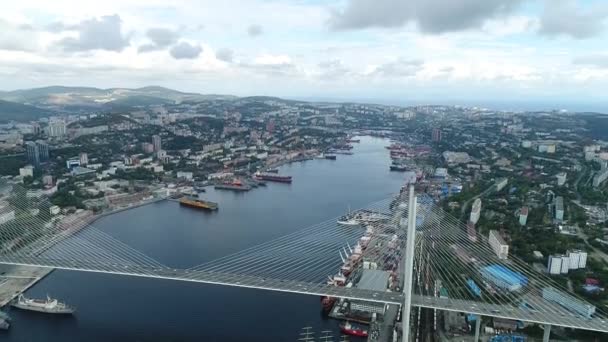 A big , white cable-stayed bridge,close-up,aerial wiev. the port of Vladivostok — ストック動画