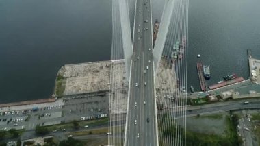 a big , white cable-stayed bridge,close-up,aerial wiev. the port of Vladivostok