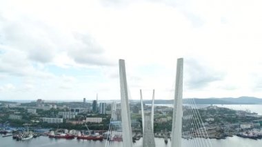 a big , white cable-stayed bridge,close-up,aerial wiev. the port of Vladivostok