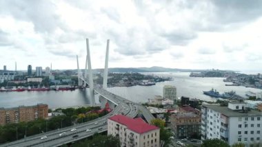 a big , white cable-stayed bridge,close-up,aerial wiev. the port of Vladivostok