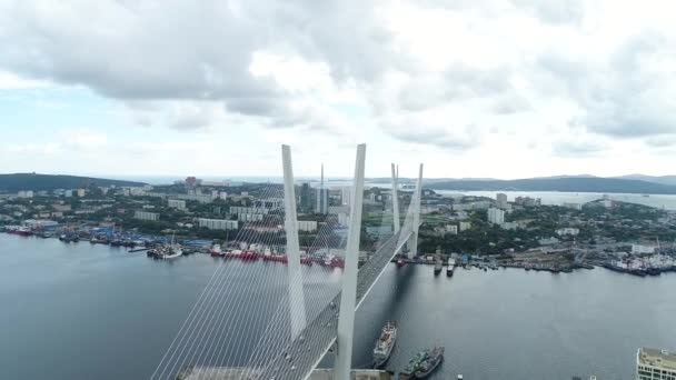 A big , white cable-stayed bridge,close-up,aerial wiev. the port of Vladivostok — ストック動画