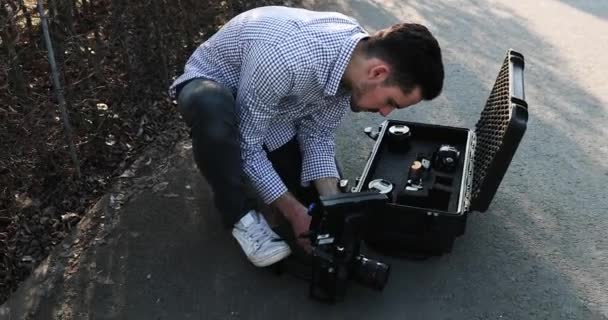 Filming and filmmaking. Young Filmmaker Skate Backstage. — Stock Video