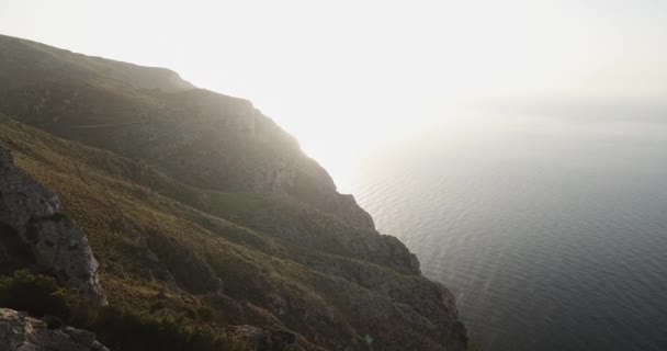 Deserted mountains on the ocean at sunrise — Stock Video