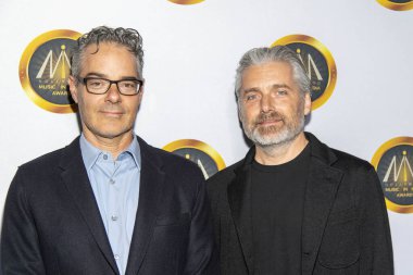 Marco Beltrami ve Buck Sanders, 20 Kasım 2019 'da Avalon Hollywood, Hollywood' da düzenlenen Hollywood Medya Ödülleri 'ne katıldı.