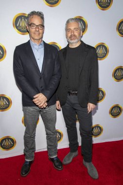 Marco Beltrami ve Buck Sanders, 20 Kasım 2019 'da Avalon Hollywood, Hollywood' da düzenlenen Hollywood Medya Ödülleri 'ne katıldı.