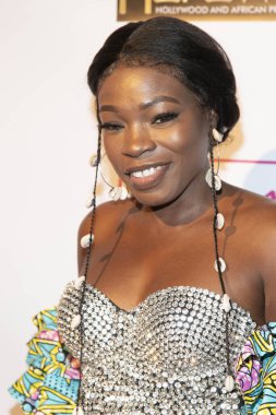 Mz Menneh, 3 Kasım 2019 tarihinde Alex Theater, Glendale, CA 'da 2019 Hollywood & Afrika Prestijli Ödülleri' ne (HAPAwards) katılmaktadır.