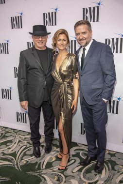 Mike Post, Atli Orvarsson with wife Anna attend 35th Annual BMI Film, Tv & Visual Media Awards at Beverly Wilshire Hotel, Beverly Hills, CA on May 15, 2019 clipart