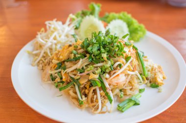 Tay ahşap masa, geleneksel Tay gıda, yakın Tarih beyaz disk kadar yastık.