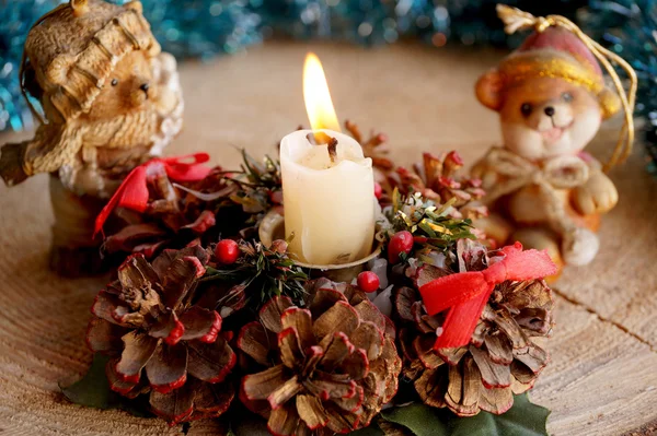 Wax candle on a support from cones — Stock Photo, Image