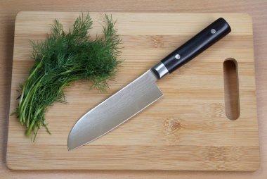 Knife cook universal with a blade like Santoku clipart