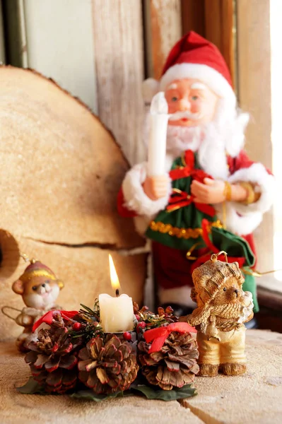 Toy Santa Claus with a candle in a hand — Stock Photo, Image