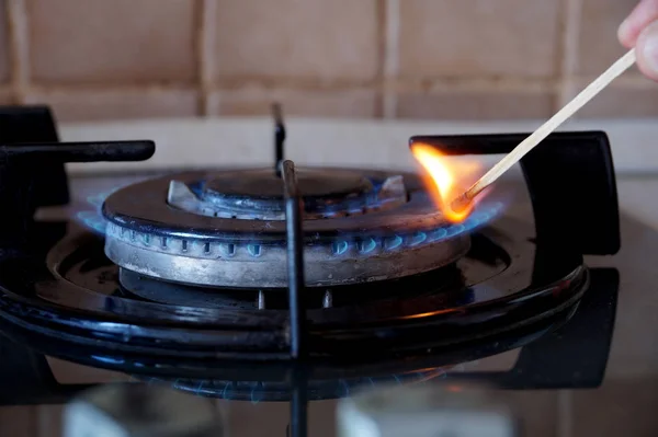 Ignition of a gas ring on the stove — Stock Photo, Image