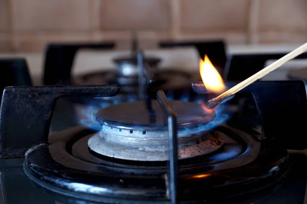 Ignition of a gas ring on the stove — Stock Photo, Image
