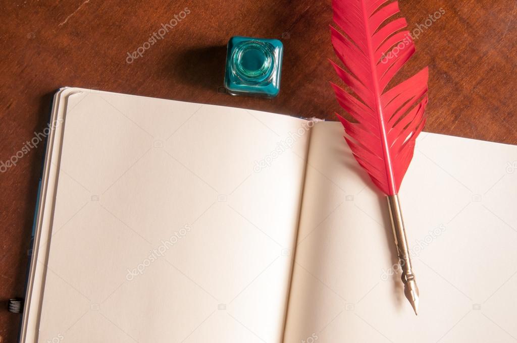 Quill pen and sketchbook