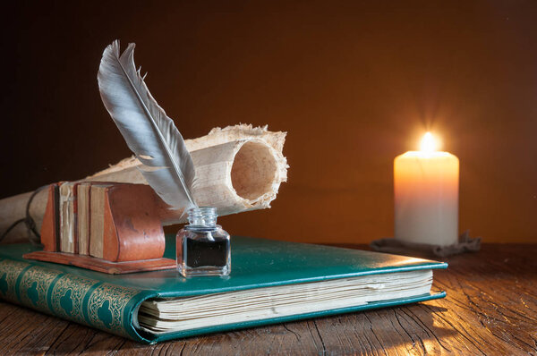 Quill pen by candle light