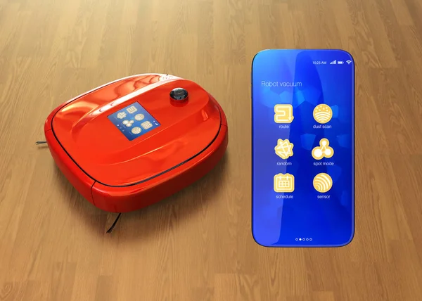 Красный роботизированный пылесос и смартфон — стоковое фото