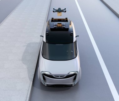 Karton Koli teslim etmek için van dan havalandığını bir dron önden görünümü