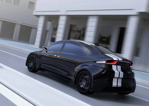 Rear view of black sports car driving on the street — Stock Photo, Image