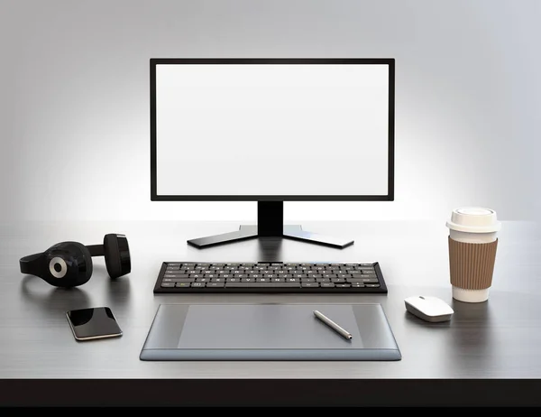 Vista frontal del monitor de pantalla en blanco, tablet PC y auriculares inalámbricos —  Fotos de Stock