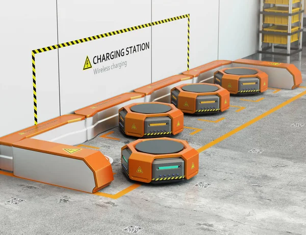 Роботы-склады заряжаются на зарядной станции — стоковое фото