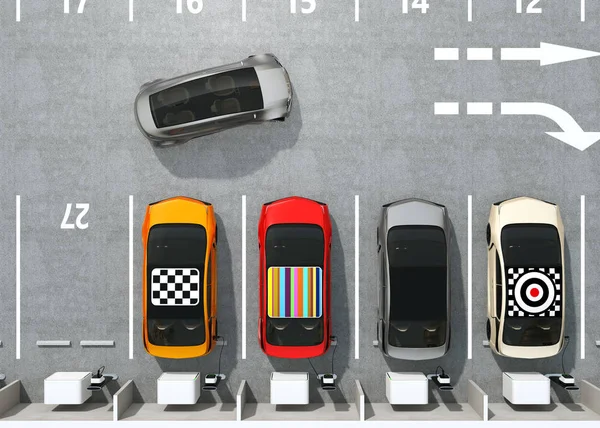 Вид с воздуха на красочные EV зарядки на парковке — стоковое фото