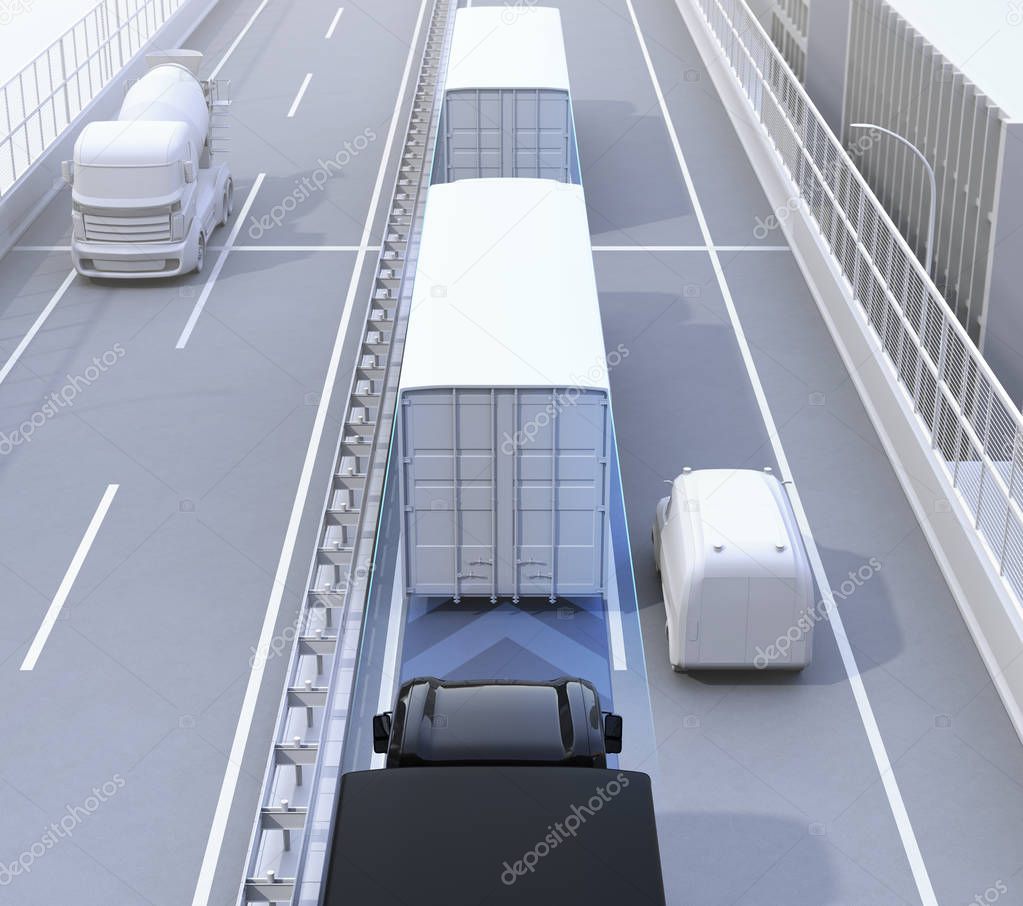 Rear view of autonomous truck fleet driving on highway