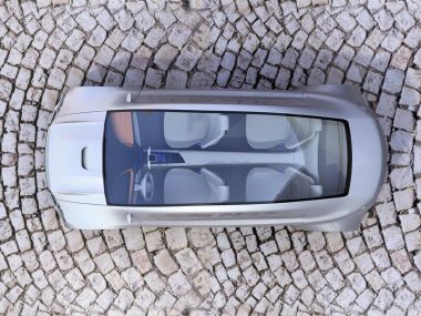 Top view of autonomous car on cobblestone ground clipart