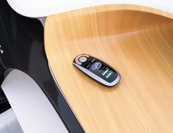 Smart car key on electric car's dashboard — Stock Photo, Image