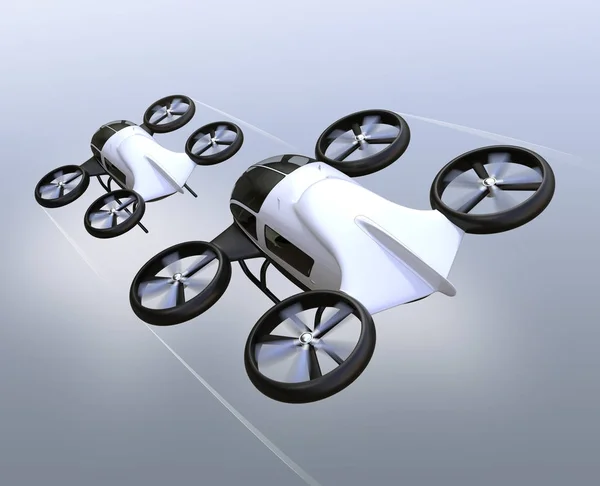 Rear view of two self-driving passenger drones flying in the sky — Stock Photo, Image
