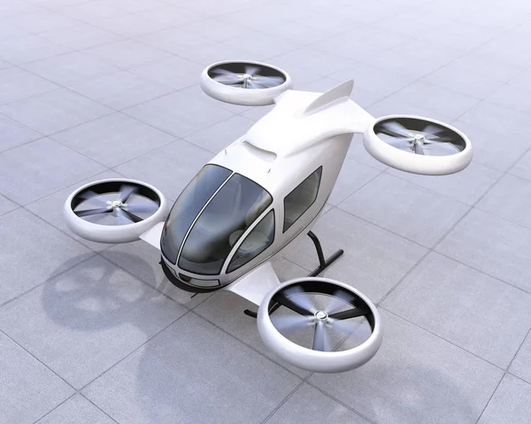 White self-driving passenger drone landing on the ground — Stock Photo, Image