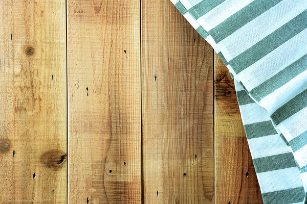 Toalha de mesa em fundo de madeira . — Fotografia de Stock