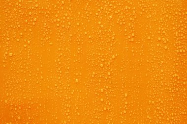 Koyu turuncu zemin üzerine su damlası kadar kapatın.