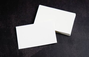 Mockup white business card on black background.