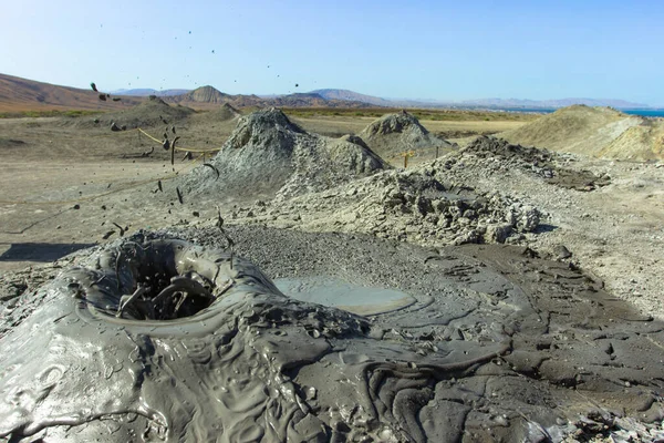 Mud volcanoes of Gobustan. Active volcanoes. Valley of craters and volcanoes. Azerbaijanian nature. Bubbling crater of a mud volcano. — Stock Photo, Image