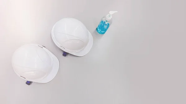 white safety helmet after clean by alcohol protect covid-19 virus in construction area