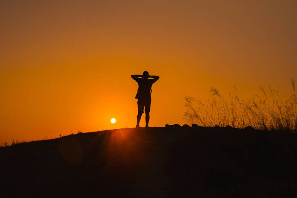 web banner wanderlust and adventure travel from silhouette man hiking and stand on top of the mountain in summer season