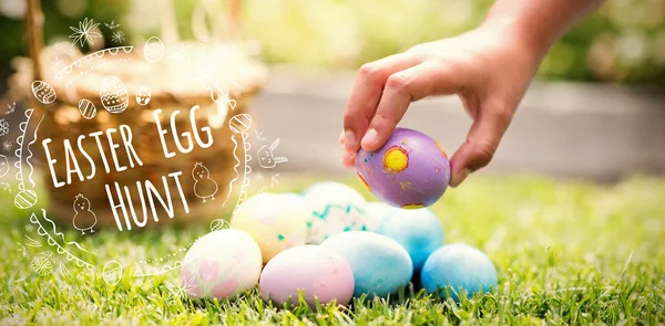 Little girl collecting easter eggs — Stock Photo, Image