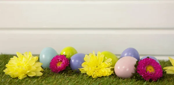 Multicolored Easter egg on grass — Stock Photo, Image