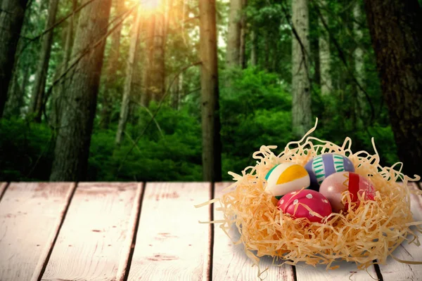 Patterned Easter eggs in paper nest — Stock Photo, Image