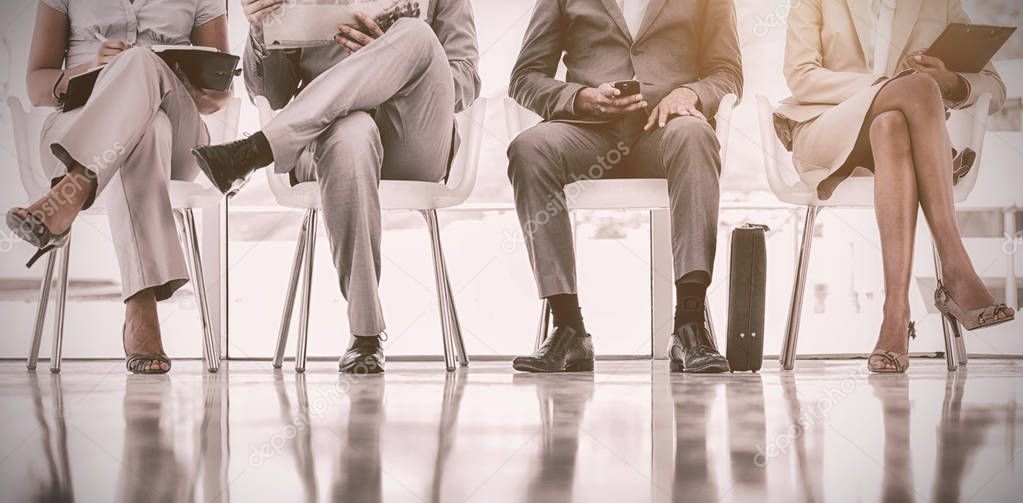 business people waiting in office