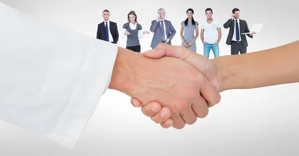 Handshake with people in background — Stock Photo, Image