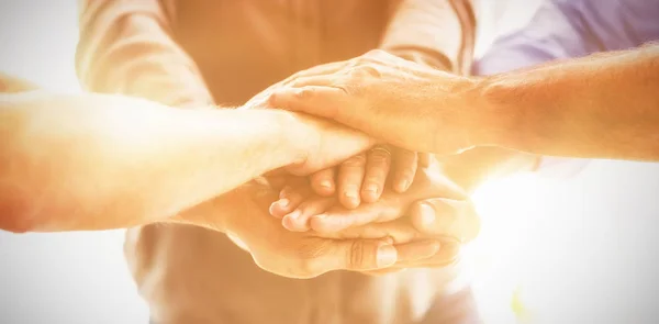 Business team stacking hands in office — Stock Photo, Image