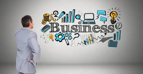 灰色の背景にさまざまなアイコンでビジネス テキストを見て実業家 — ストック写真
