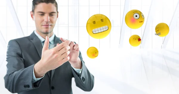 Uomo d'affari con emoji contro finestra bianca — Foto Stock