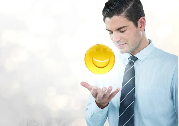 Obchodní muž s rukou otevřené a emoji s hrdlem proti bílým bokeh — Stock fotografie