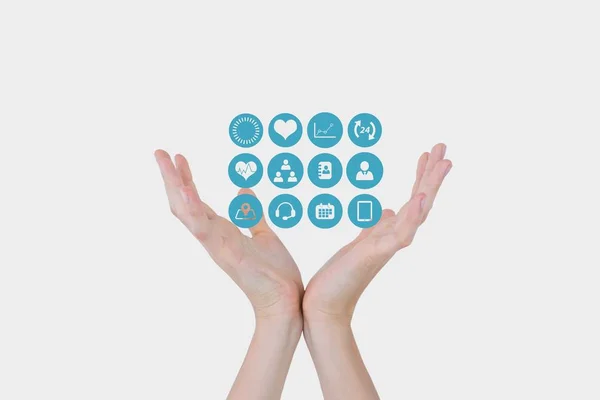 Digital sammansatt bild av händer med medicinsk ikoner — Stockfoto