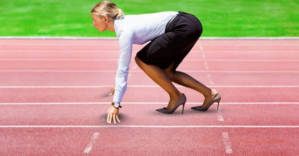 Digitally generated image of Businesswoman on starting point at racing track Stock Image