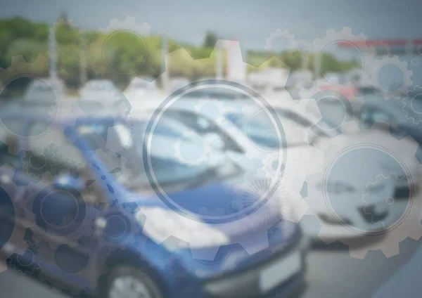 Autos auf dem Parkplatz mit Zahnradgrafik — Stockfoto