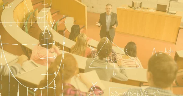 Professor unterrichtet Studenten mit Diagrammen im Vordergrund — Stockfoto