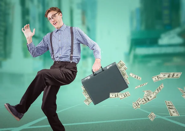 Business man on track with money falling out of briefcase